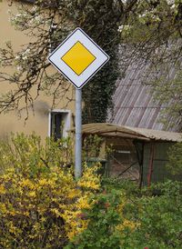 View of road sign on grassy field