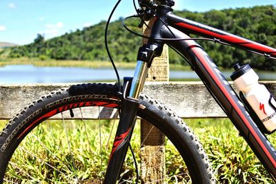 Close-up of bicycle wheel in grass