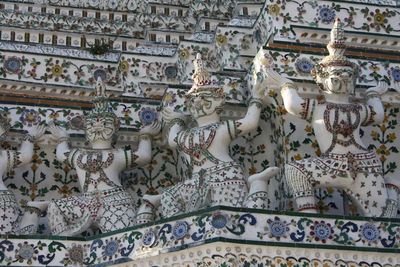 Low angle view of statues at wat arun