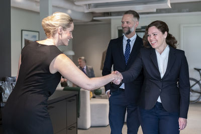 Portrait of business colleagues shaking hands