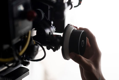 Close-up of hand photographing camera