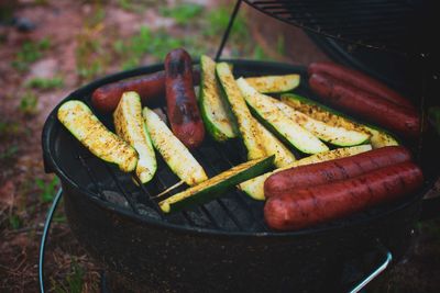 High angle view of meat on barbecue grill