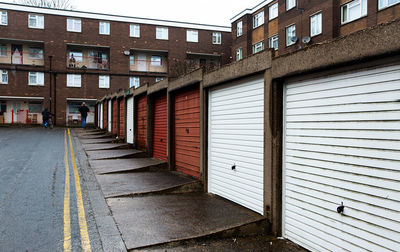 Rows of garages and council flats on a social housing estate in the north of england