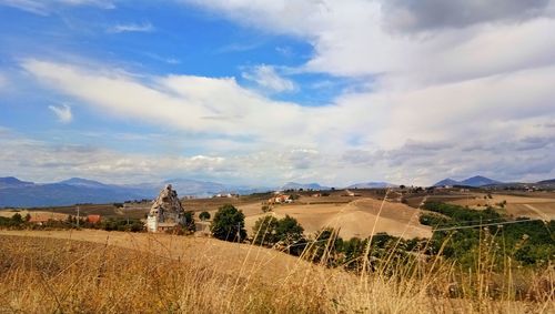 Panoramic view of field against sky