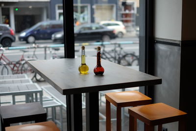 High angle view of oil bottles on table at restaurant