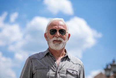 Portrait of man against sky