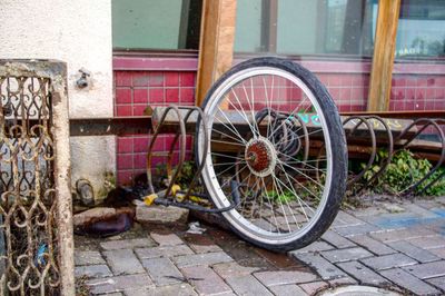 Bicycle parked against building