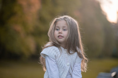 Beautiful little child girl walking in a park