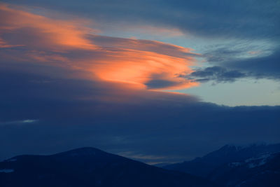 Scenic view of mountains against sky during sunset