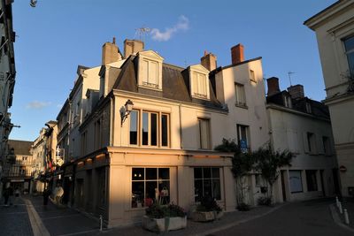 Street amidst buildings against sky