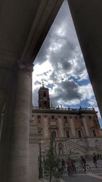 Low angle view of building against cloudy sky