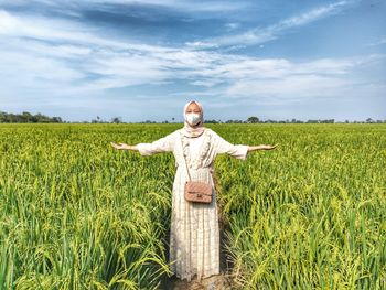 Full length of women standing on field