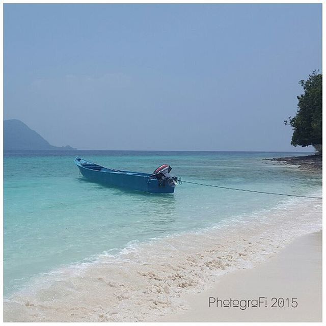 sea, water, beach, horizon over water, nautical vessel, transportation, boat, transfer print, shore, mode of transport, sand, tranquility, tranquil scene, clear sky, scenics, beauty in nature, nature, auto post production filter, sky, copy space