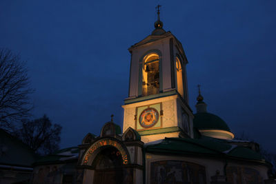 Low angle view of bell tower against sky