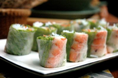 Close-up of fresh spring rolls served on table