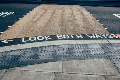 High angle view of road sign on street