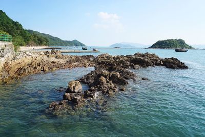 Scenic view of sea against blue sky