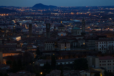 High angle view of illuminated cityscape at night