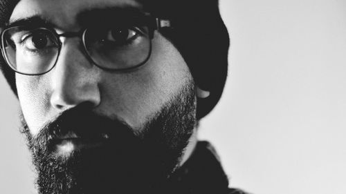 Close-up of thoughtful man with eyeglasses