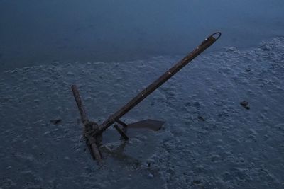 High angle view of rusty chain on field