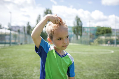 Portrait of boy on grass