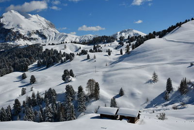 Scenic view of snow covered mountains against sky