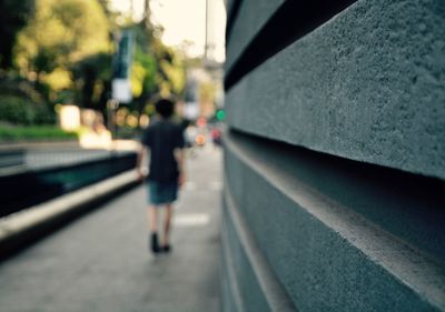 Rear view of man on road