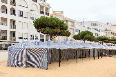 Built structure on beach against buildings in city