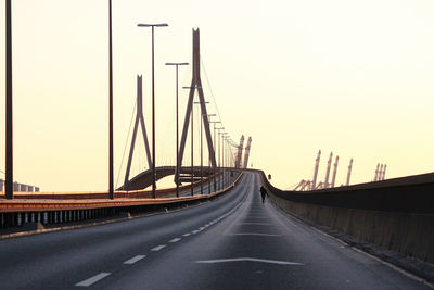 View of bridge over road against clear sky
