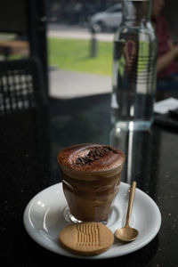 Close-up of coffee served on table at cafe