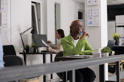 Side view of woman using mobile phone