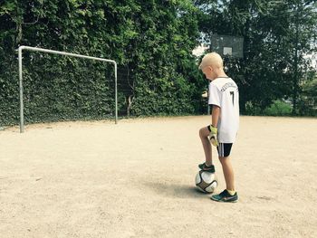 Boy playing with umbrella