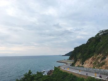 High angle view of calm sea against cloudy sky