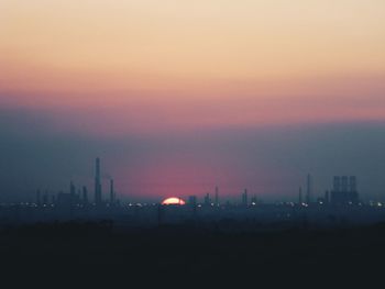 Silhouette of city at dusk