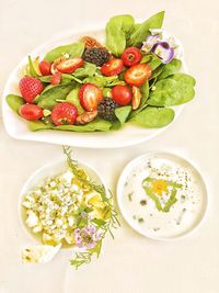 High angle view of chopped fruits in bowl on table