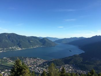 Scenic view of mountains against blue sky