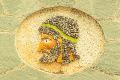 Close-up of art on wall