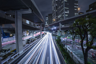 High angle view of light trails on road at night