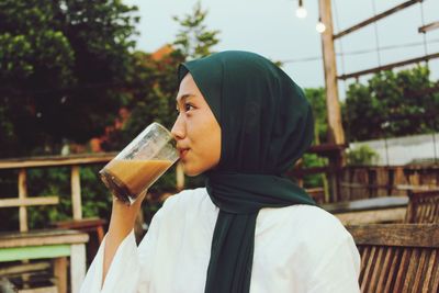Indonesian muslim with coffee