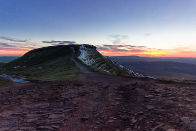 Scenic view of mountains against sky during sunset