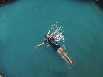 High angle view of man swimming in sea