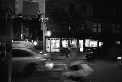 Cars on street in city at night
