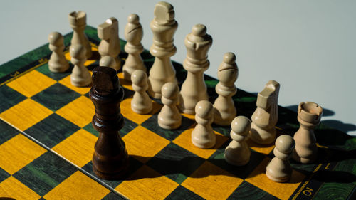 Close-up of chess pieces against white background