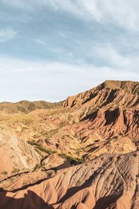 Scenic view of arid landscape against sky