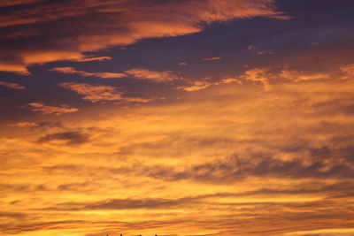 Low angle view of dramatic sky during sunset