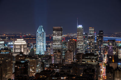 Illuminated buildings in city at night