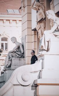 Low angle view of statue against building