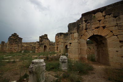 Old ruin building against cloudy sky