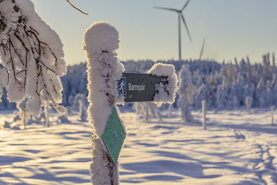 Snow covered landscape against clear sky during sunrise near a ski resort in ludvika sweden