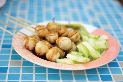 High angle view of fruits in plate on table